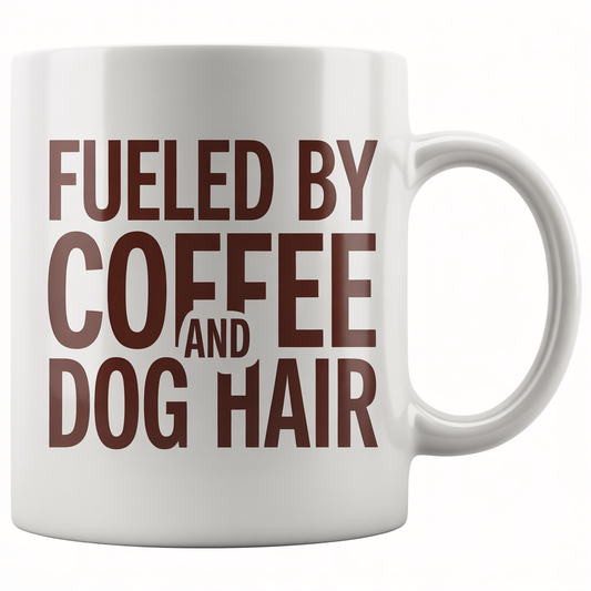 Front view of a white ceramic coffee mug with 'Fueled by Coffee and Dog Hair' text, perfect dog mom gift.