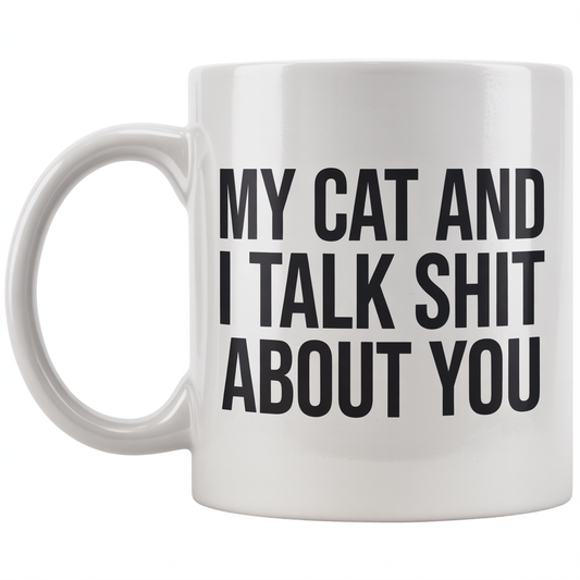 Front view of a white ceramic coffee mug with 'My Cat And I Talk Shit About You' text, ideal cat lover gift.
