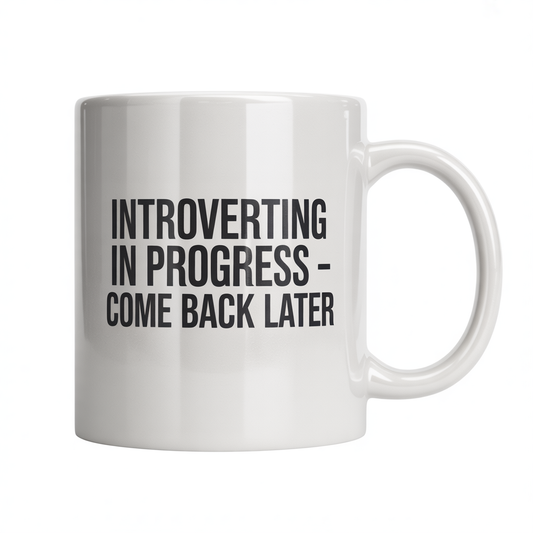 White ceramic coffee mug with text 'Introverting In Progress – Come Back Later', perfect for introverts and solitude lovers.