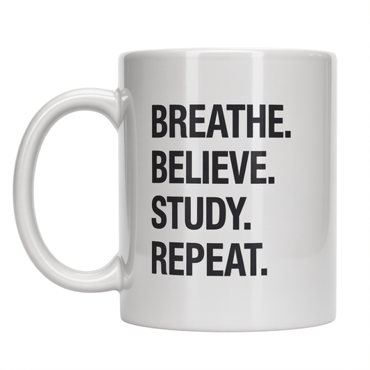 White ceramic coffee mug with 'Breathe. Believe. Study. Repeat.' text, ideal for student motivation and study inspiration.